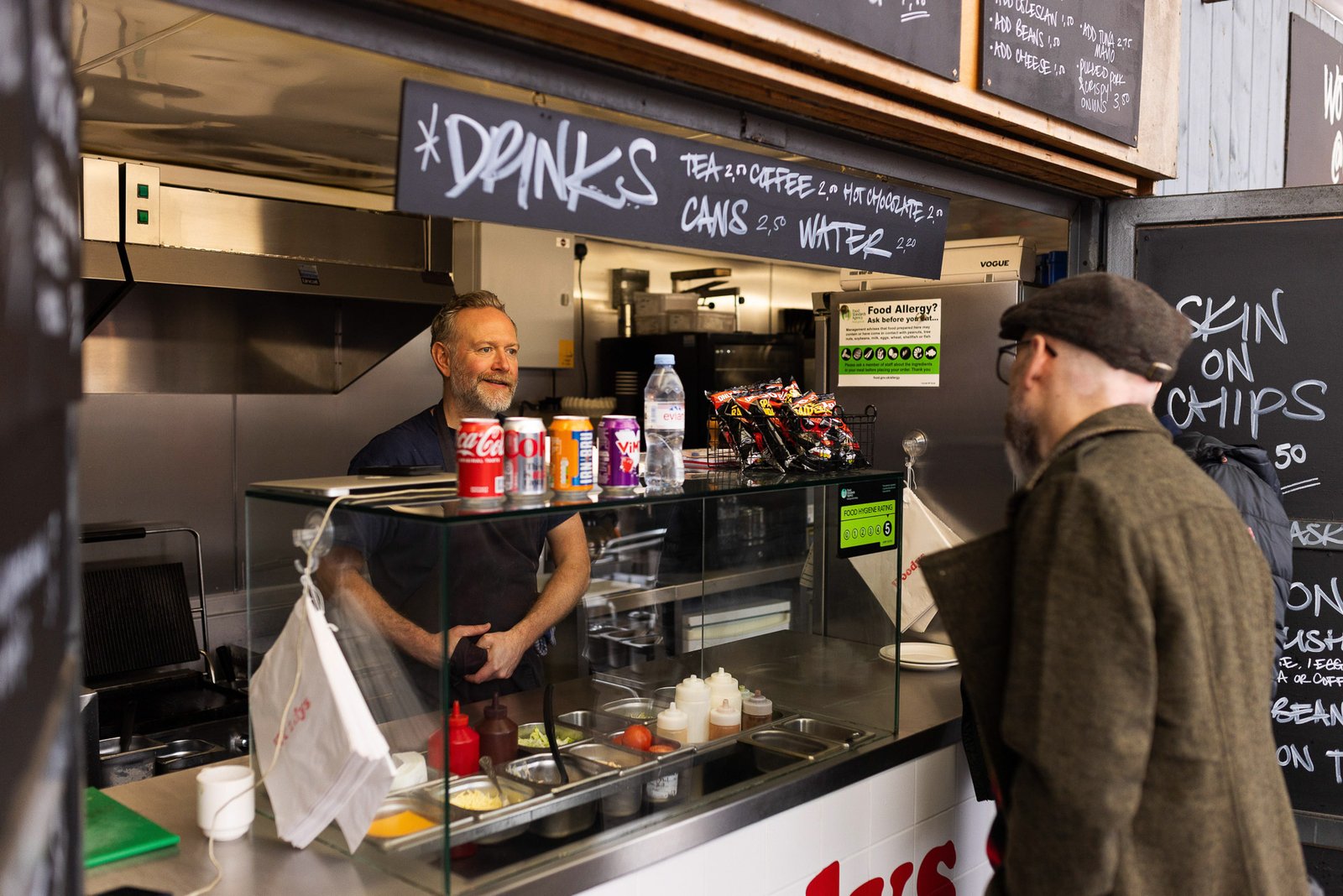 James talking to a business owner