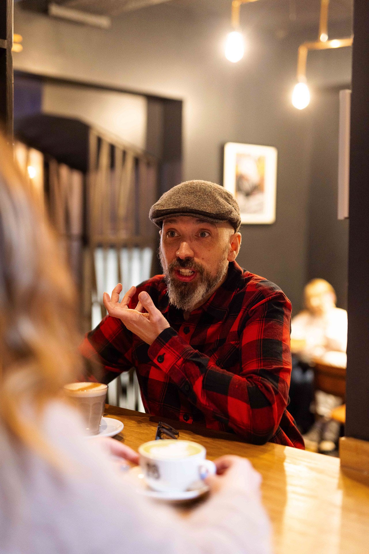 James with a client in a coffee shop